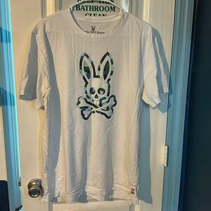 Psycho bunny short sleeve white t shirt with bunny logo on front.